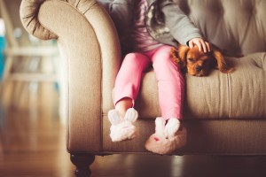 Girl on Sofa with Dog